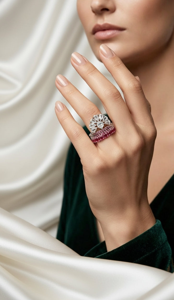 Fan Halo Tiered Ring with white crystal fan halo and silver & fuchsia pink multi-tiered band, luxury designer jewelry worn on hand in elegant interior.