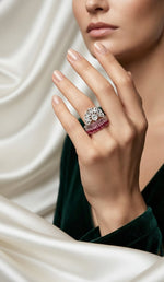 Fan Halo Tiered Ring with white crystal fan halo and silver & fuchsia pink multi-tiered band, luxury designer jewelry worn on hand in elegant interior.