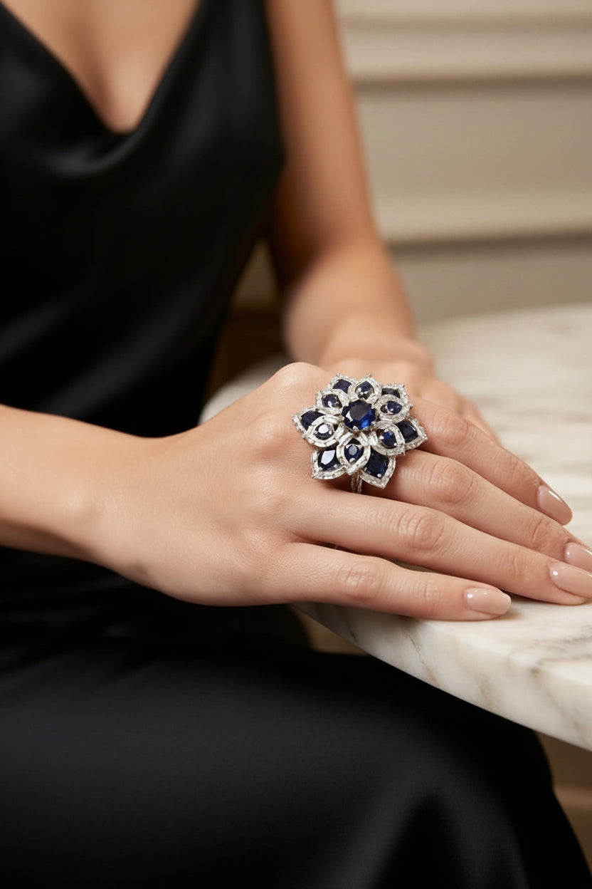 Posh model wearing the Famaza Couture Royal Midnight Blossom American Diamond and blue sapphire floral cocktail ring.