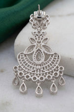 Elegant silver crystal chandelier earring showing the post and clear rubber stopper design, placed next to additional replacement earring backs."