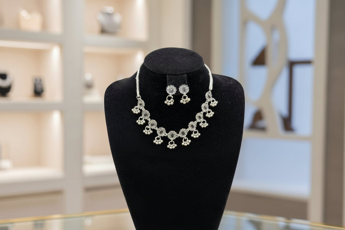 Full view of the artisan Midnight Bloom choker and earring set displayed on a black velvet jewelry bust.