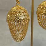 Detail view of S hook attachment on gold hair support ear chain for jhumka earrings