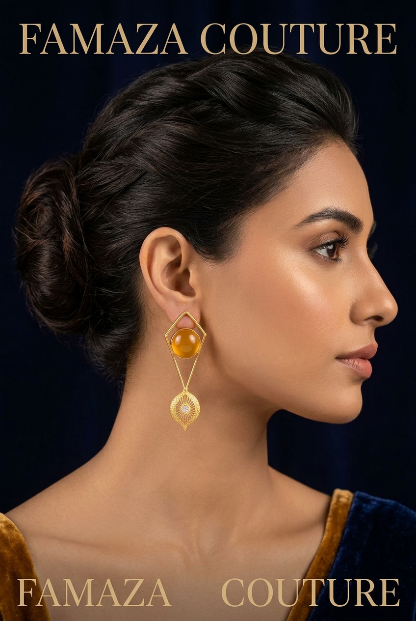 Model is wearing and showing the gold tone stone geometric dangle earring
