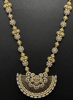 Gold and diamond necklace on a black background