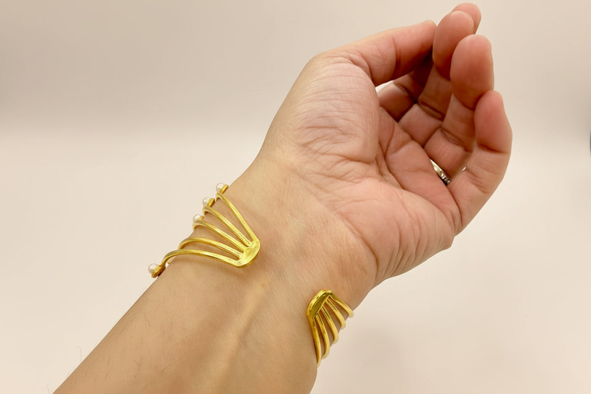 Close up of golden pearl bracelet party wear jewellery Wembley
