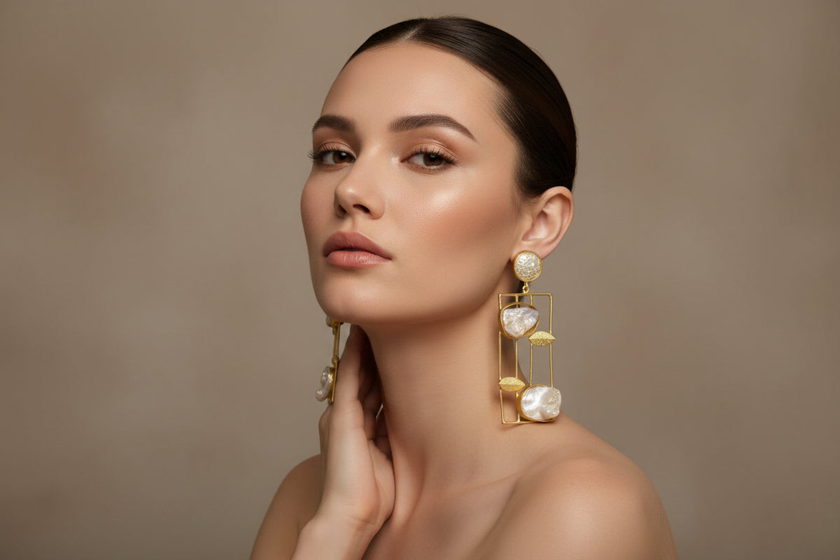 Gold brass and baroque pearl dangling earrings.