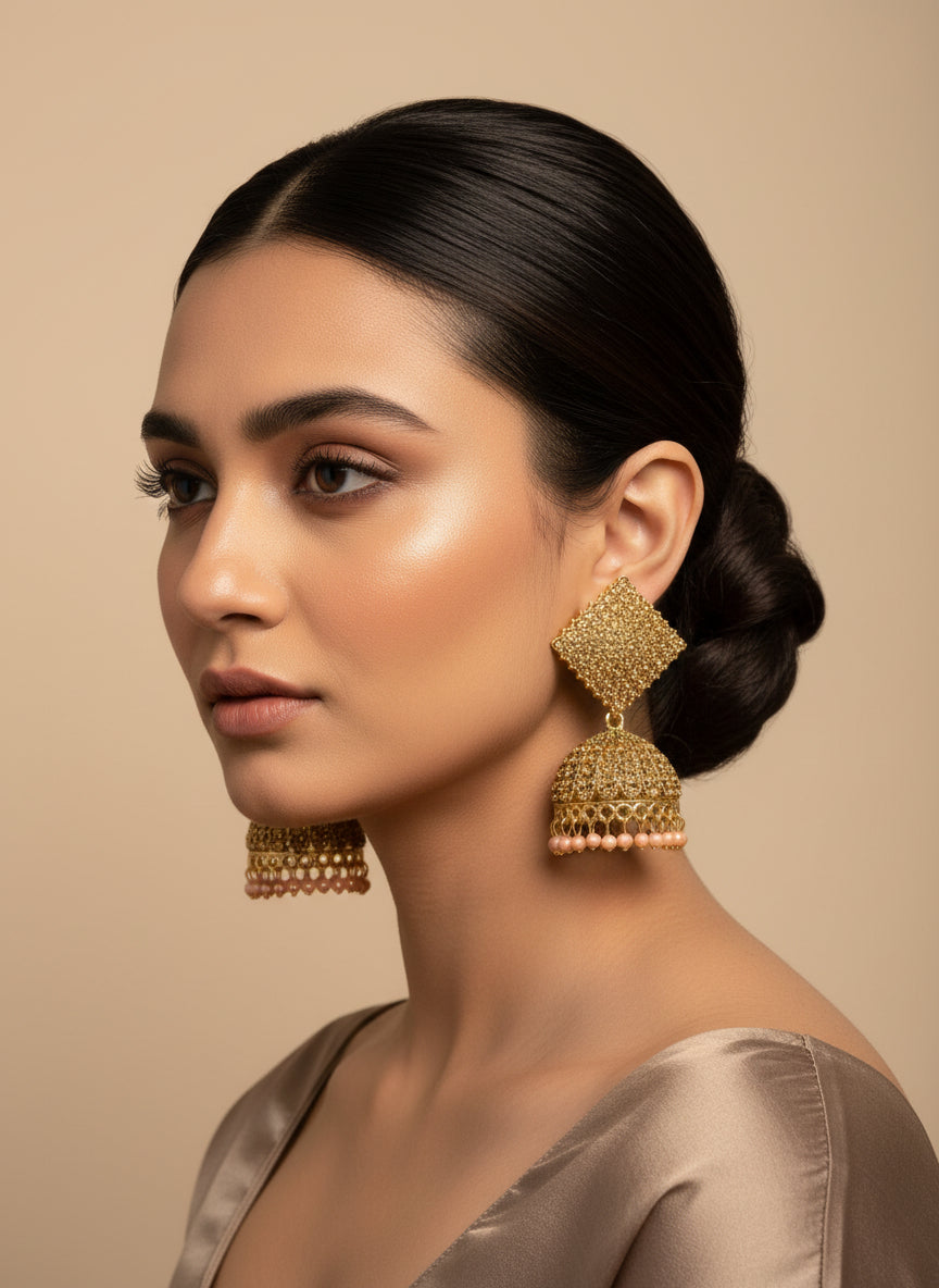 Model wearing gold nano square jhumka earrings