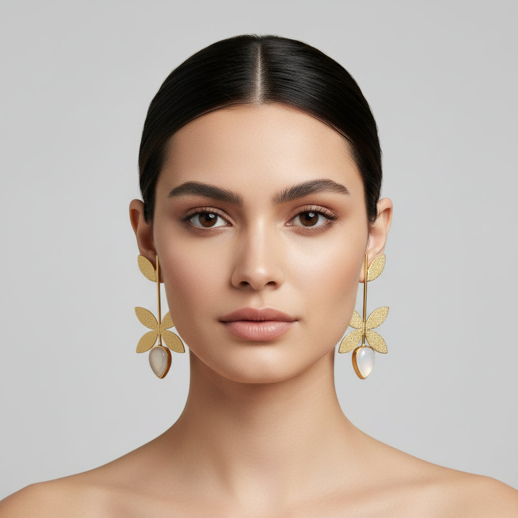 Gold leaf earrings with a white stone centre by famaza couture