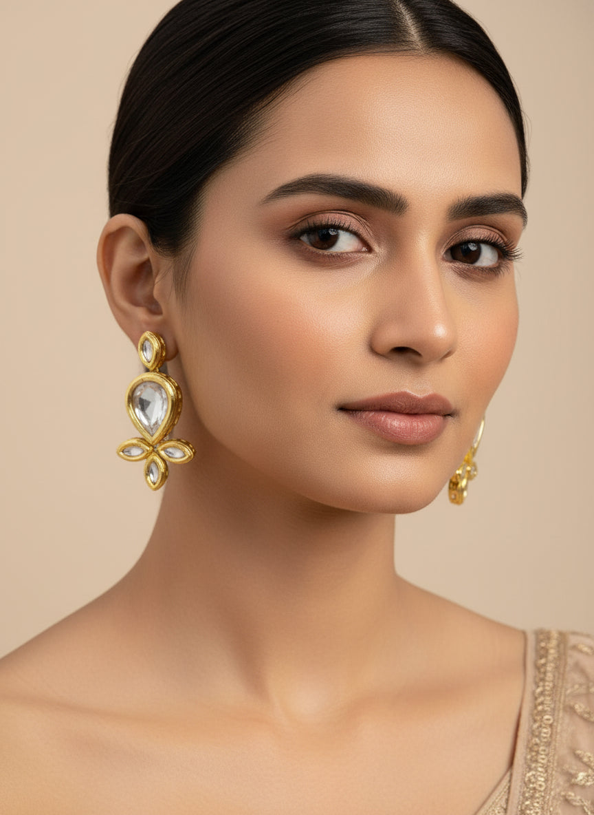 Gold tone kundan pear drop earrings by famaza couture 