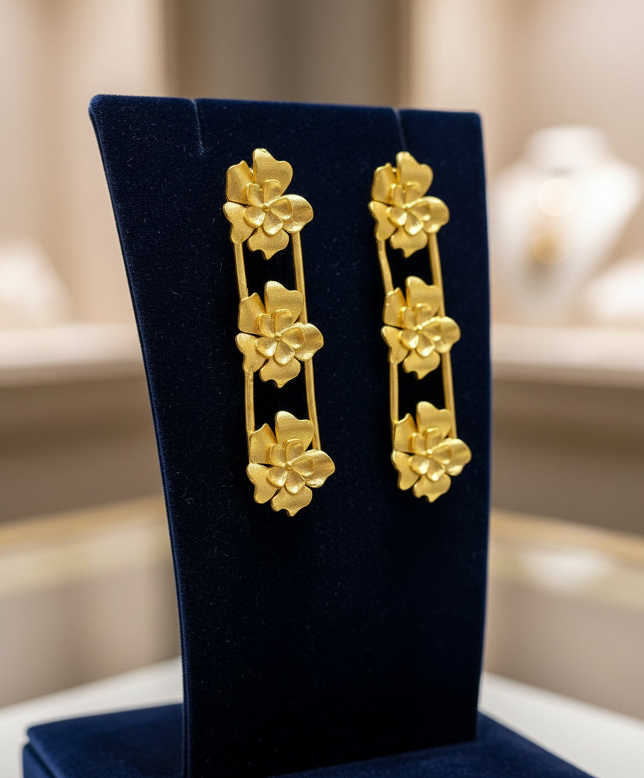 Golden 3 flowers in down line detailed party wear earrings. 