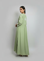back side desing of the Green Naira Cut long dress with white embroidery and high slits on both sides by famaza couture 