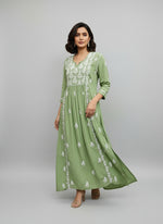 Green Naira Cut long dress with white embroidery and high slits on both sides by famaza couture 