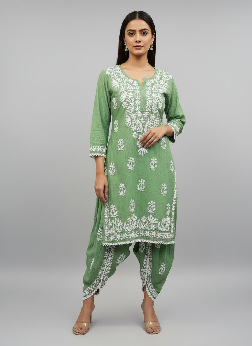 Green colour cotton fabric kurti and dhoti trousers back side design is showing in this image.