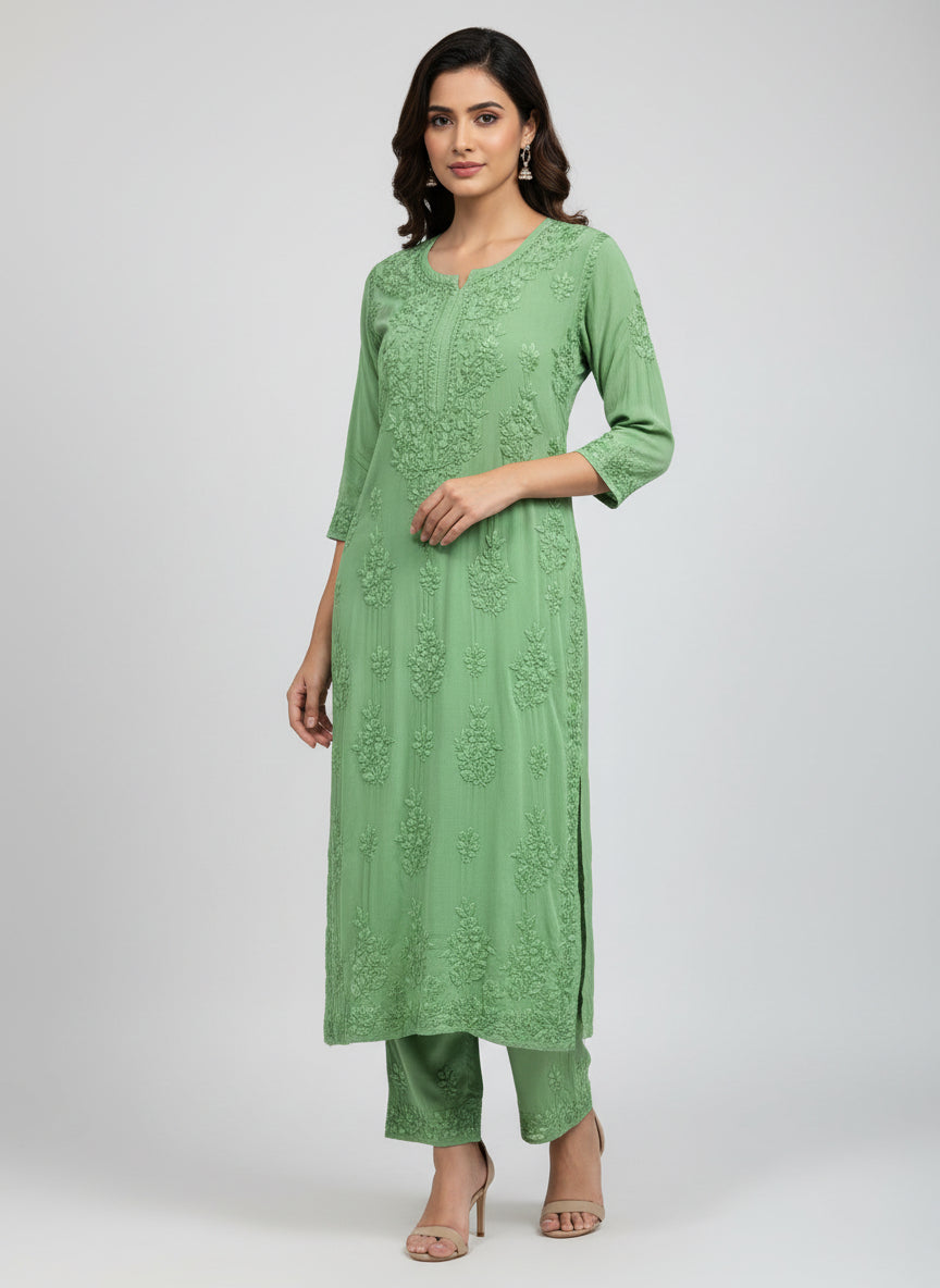 Green colour modal fabric long kurti and trousers with hand embroidery.