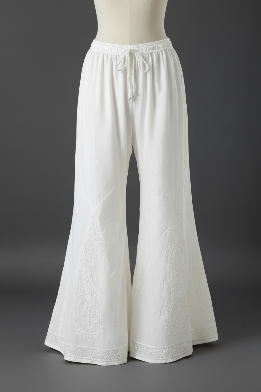 White wide-leg pants on a mannequin against a gray background