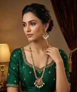  Handcrafted bridal jewellery set featuring a long multi-color floral mala and matching drop earrings.