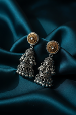 Model wearing lightweight dual-tone oxidised stone jhumka earrings with ethnic attire