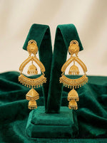 Grand Heritage gold-plated jhumka chandbali earrings displayed on a luxury green velvet stand, featuring intricate filigree work and a triple-tier drop design.
