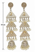 A pair of traditional Indian gold and silver-toned dangle earrings with intricate filigree work, small pearl bead accents, and a bell-shaped jhumka at the bottom, shown against a plain white background.