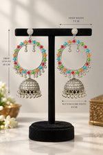 A pair of traditional Indian silver hoop jhumka earrings with colourful enamel accents in red, green, and blue, displayed on a black background. The drop length from top to bottom is 14cms and hoop width is 7cms and bottom dome width is 4cms. 
