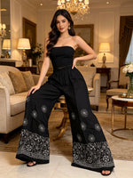 Jet black cotton flared pants with white Chikankari paisley embroidery front view