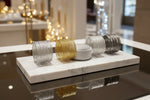 Jewellery display with bracelets on a glass shelf