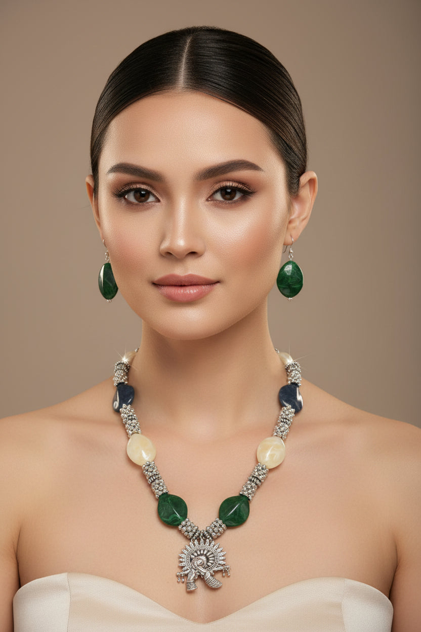 Jewellery set with necklace and earrings on a black stand