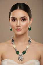 Jewellery set with necklace and earrings on a black stand