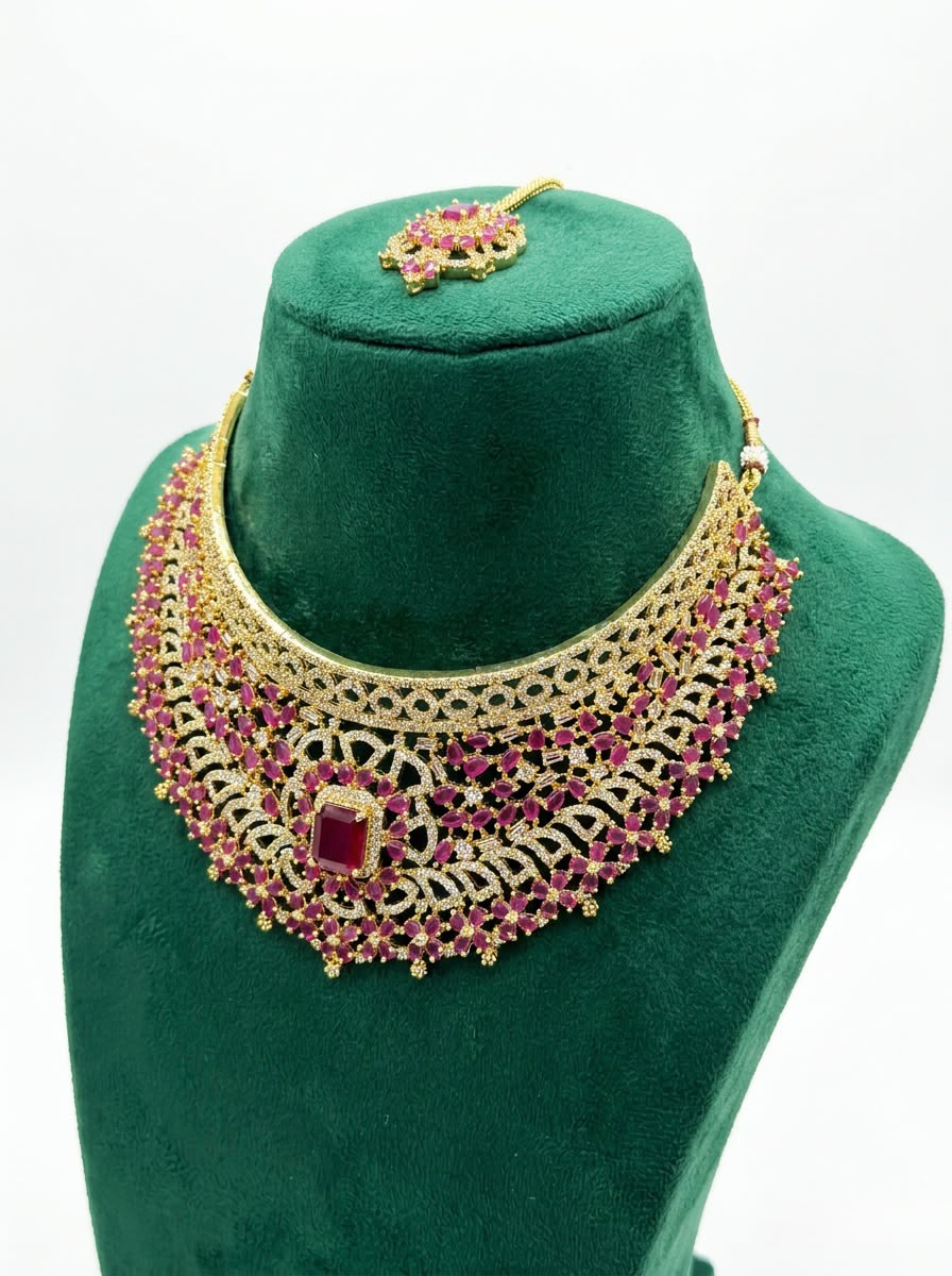 Luxury traditional ruby and gold statement bridal jewelry set presented in a premium display box.