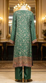 Mannequin wearing a bottle green kanni silk kurti rear view with it's full elegance and royal elegance details with plain pure raw silk trousers. 