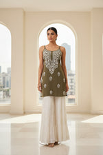Mannequin wearing a khaki colour noodle short top with white hand embroidered fared plazzo trousers