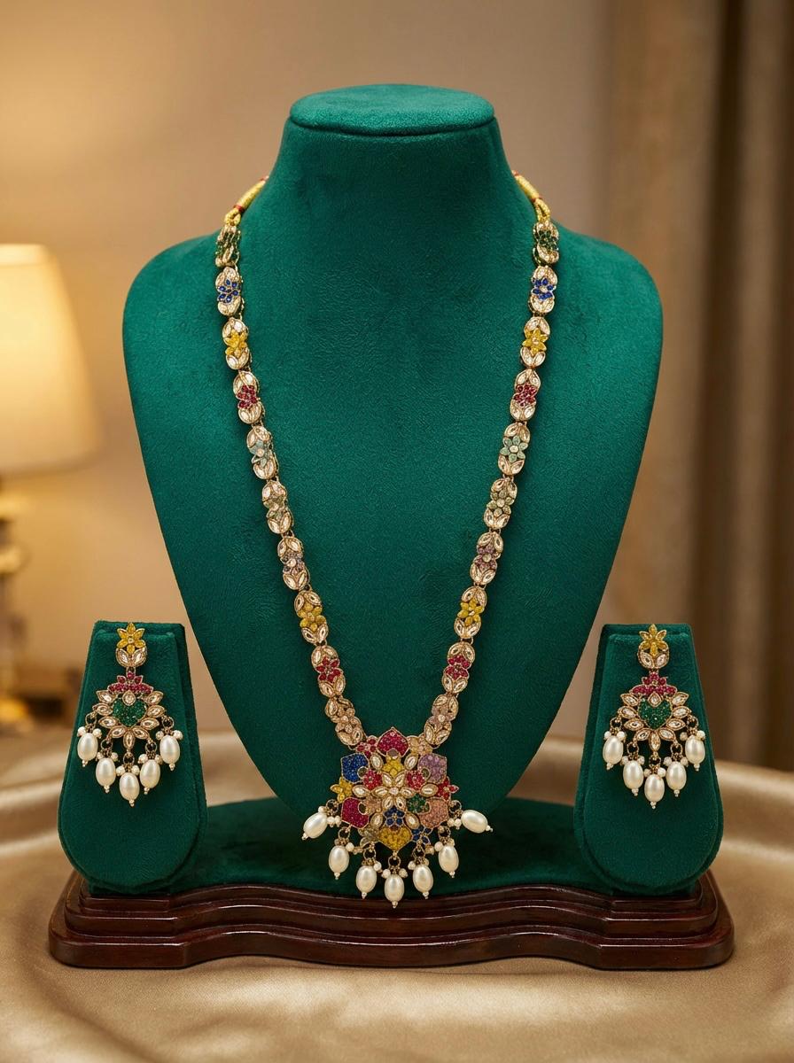Matching floral drop earrings with the necklace with white droplet accents, designed for party wear