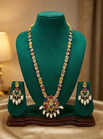 Matching floral drop earrings with the necklace with white droplet accents, designed for party wear