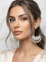 Silver-plated ethnic crescent hoop earrings featuring delicate filigree work and a dangling white pearl drop fringe, ideal for festive, bridal, or traditional ethnic party wear.