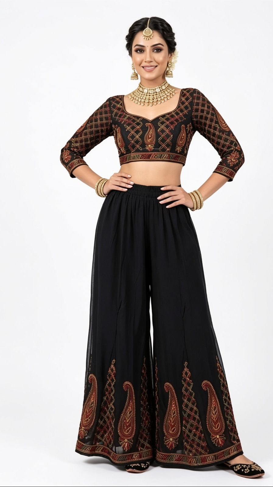 Model wearing a black georgette wide-leg sharara with intricate multi-color paisley thread embroidery at the hem (blouse not included).