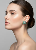 A pair of elegant silver floral cluster stud earrings featuring pear-shaped mint-green stones arranged as petals around a center cluster of sparkling clear marquise and round stones, displayed against a clean white background.
