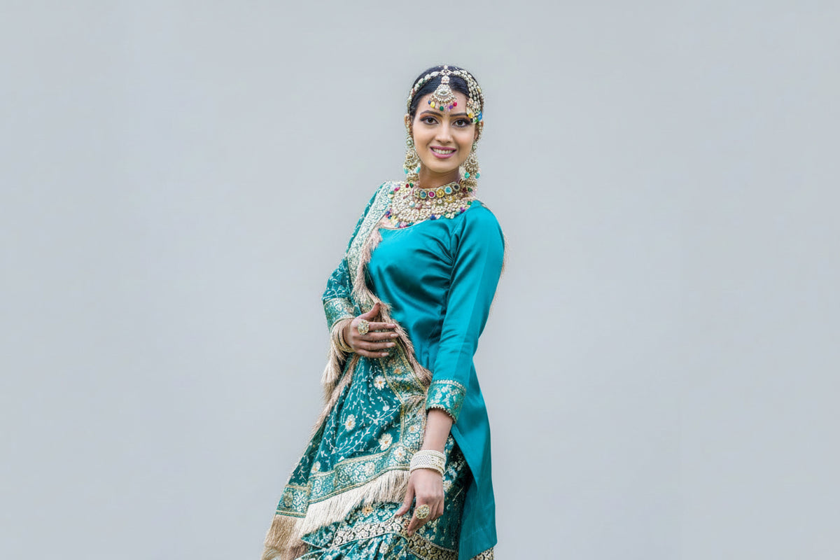 Model in traditional green bridal gharara outfit with floral patterns 