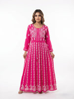 Model is showing the front view of this Hot Pink chikankari hand embroidered Aanarkali long dress.