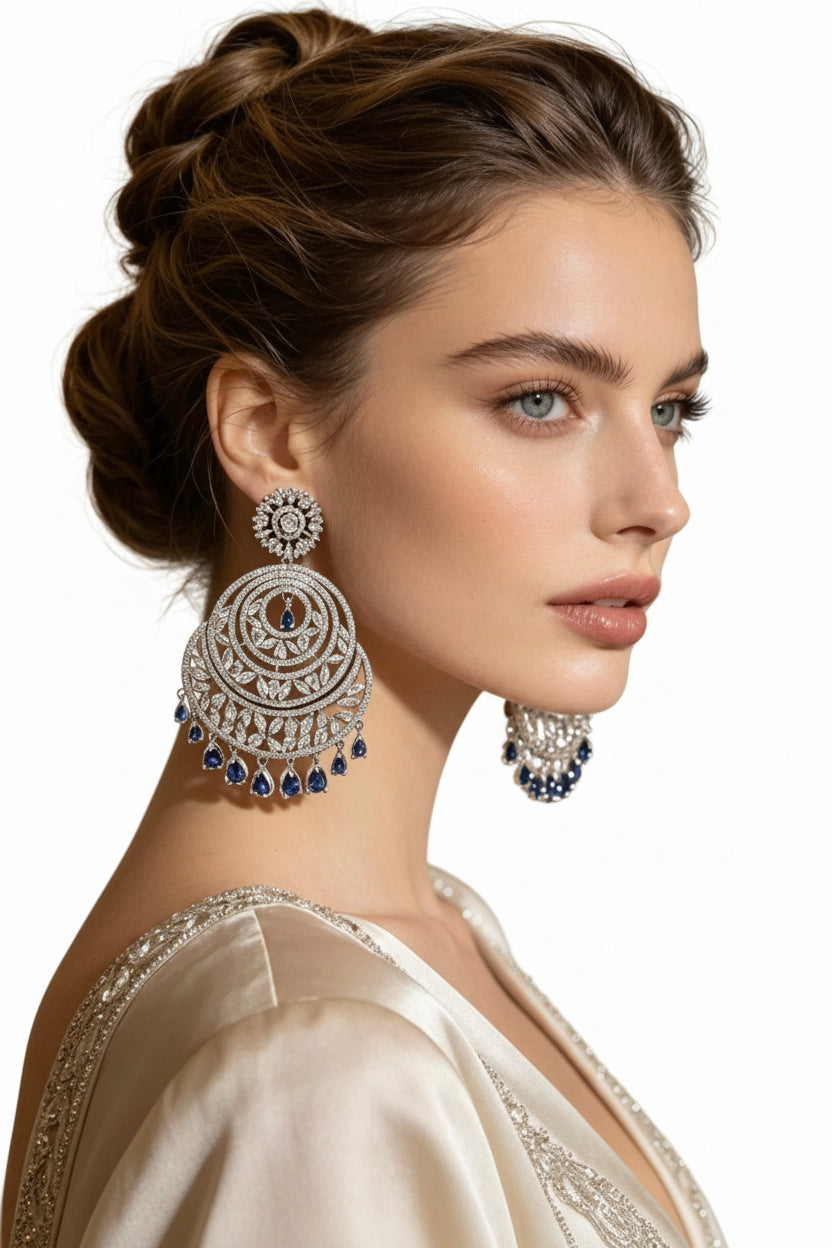 Model is wearing American diamond large chaand baali earrings. 