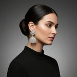 Model is wearing American diamonds jhumka earrings. Party wear earrings.
