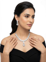 Model is wearing American diamonds necklace and earrings jewellery set. 