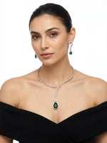 Model is wearing and displaying this unique style American diamond jewellery set with emerald green centre stone and nano white cubic zirconia 
