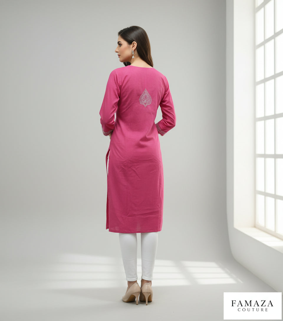 Model is wearing and posing in this hot pink colour cotton kurta back side design with white hand embroidery and wearing white jeans by famaza couture 