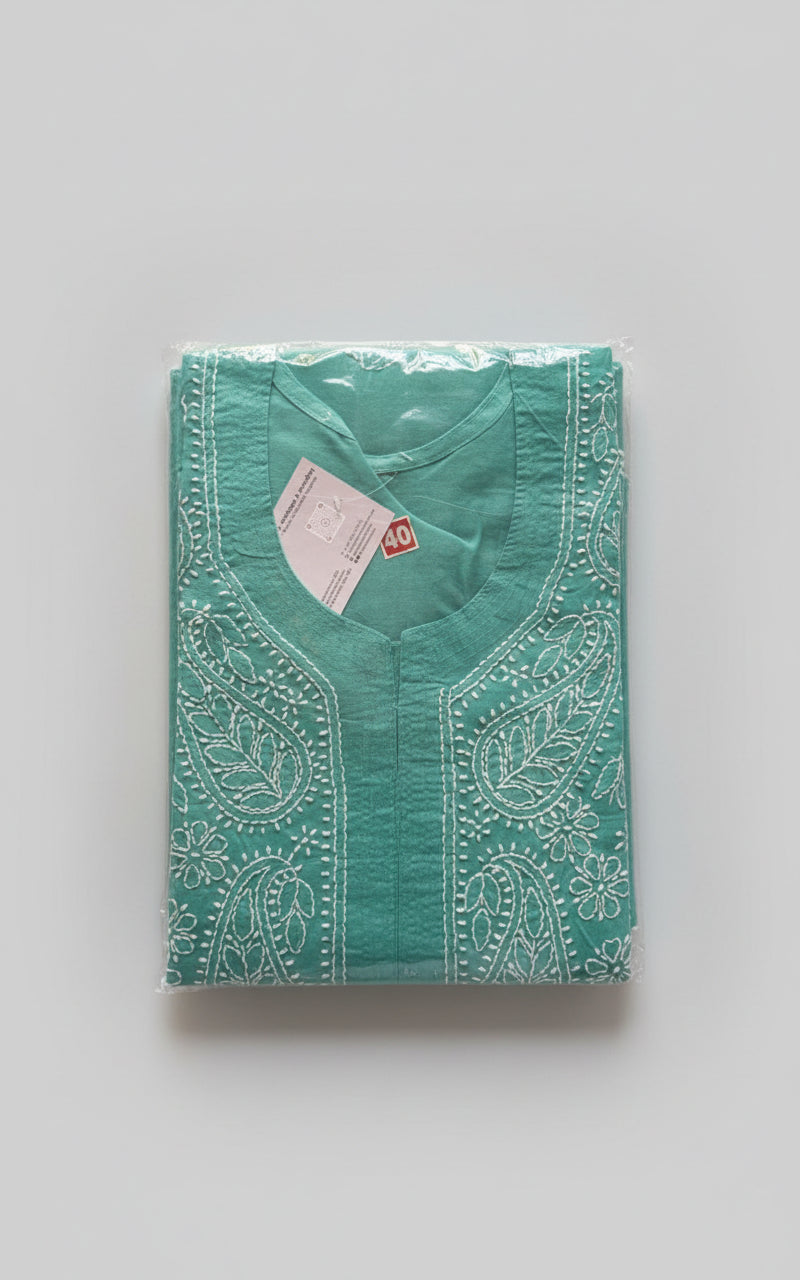 Model is wearing and posing in this sea green colour cotton kurta front side design with white hand embroidery and wearing white jeans by famaza couture 