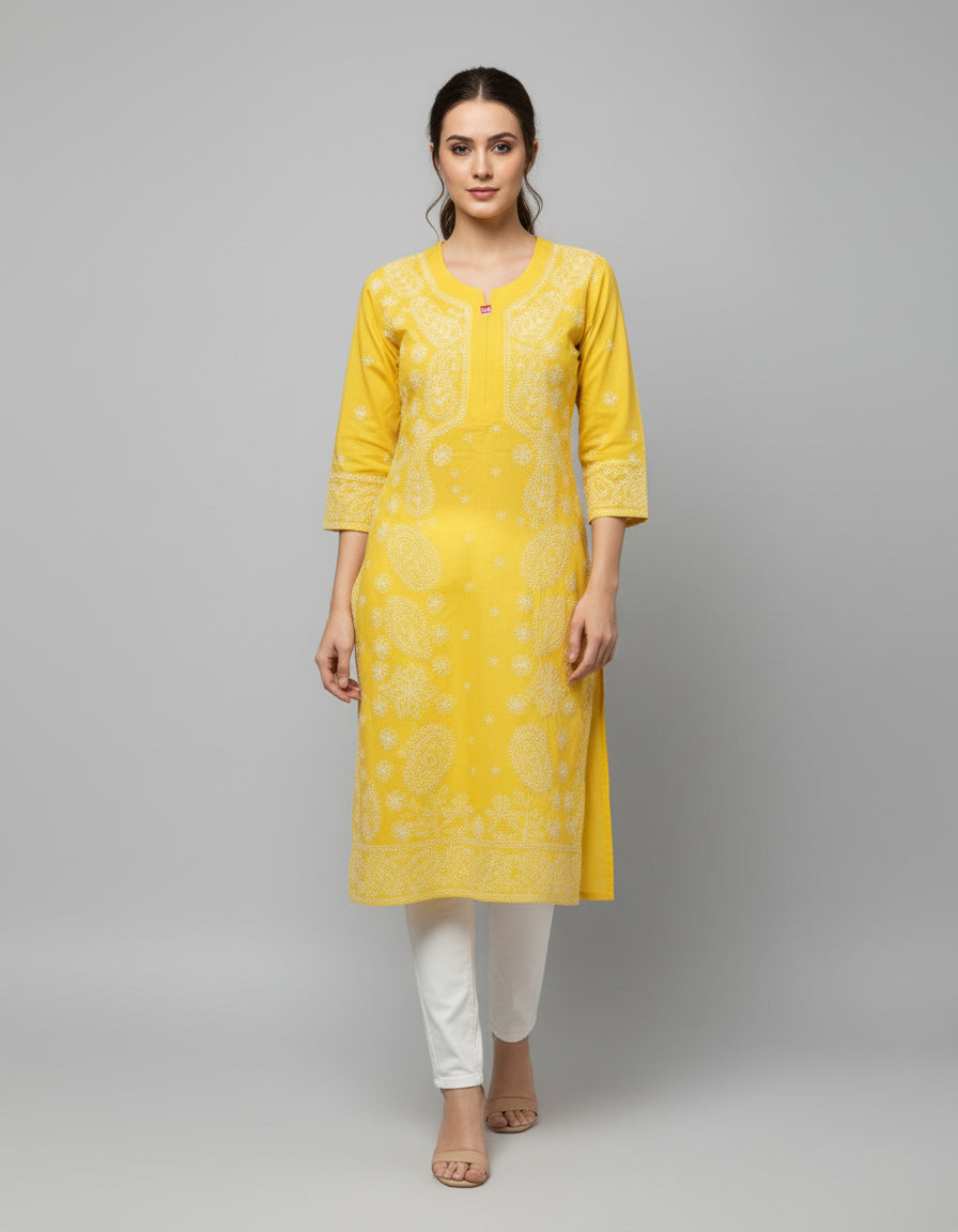 Model is wearing and posing in this yellow colour cotton kurta front side design with white hand embroidery and wearing white jeans by famaza couture 