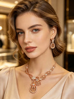 Model is wearing and showing the Rose Gold polished American Diamond jewellery set with matching earrings. 