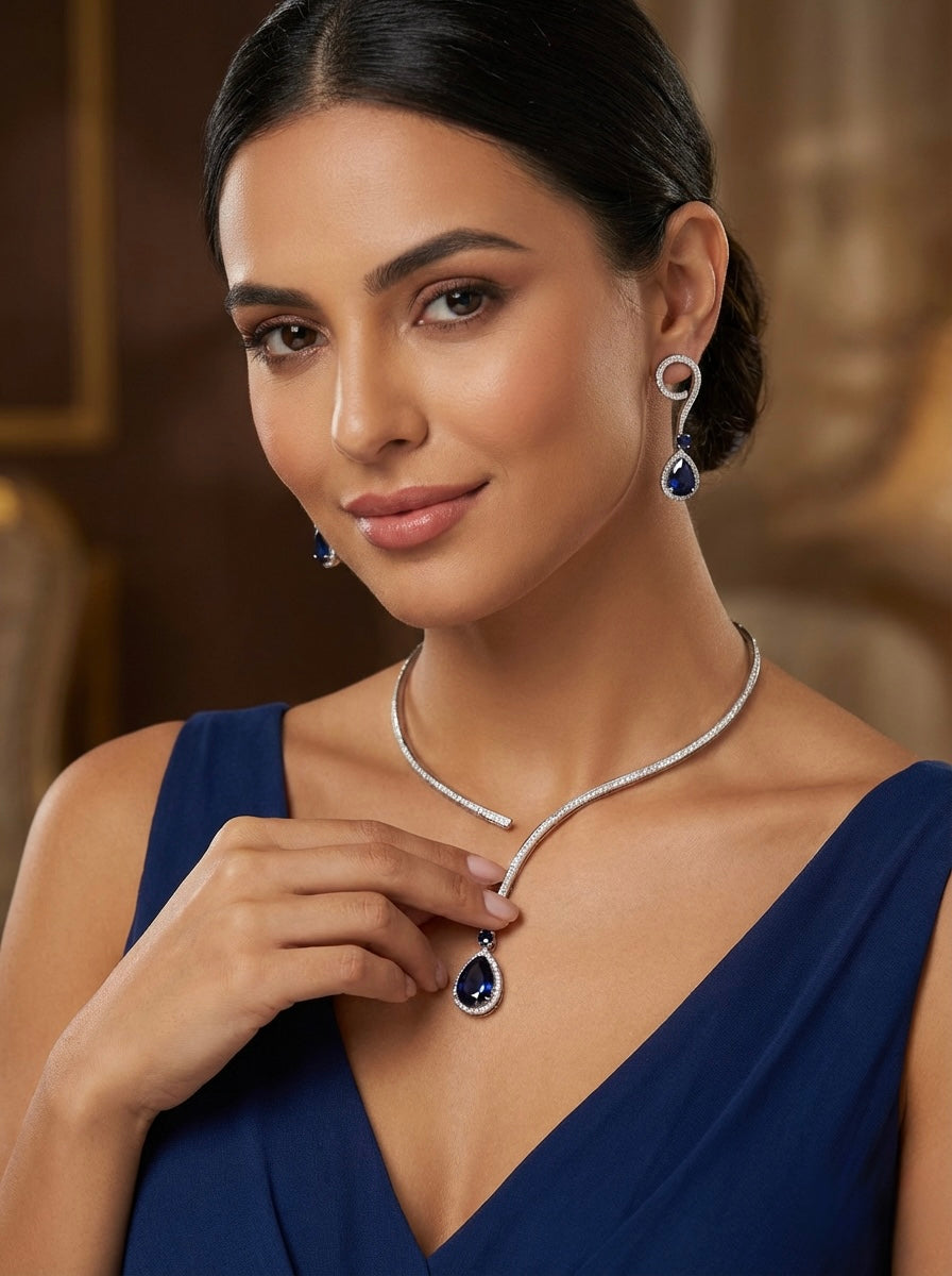 Model is wearing the unique style American diamond jewellery set with navy blue centre stone and nano white cubic zirconia 