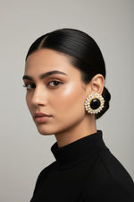 Model wearing posh black Mona Lisa stone studs with 18k gold plating and nano pearls for elegant evening jewellery.