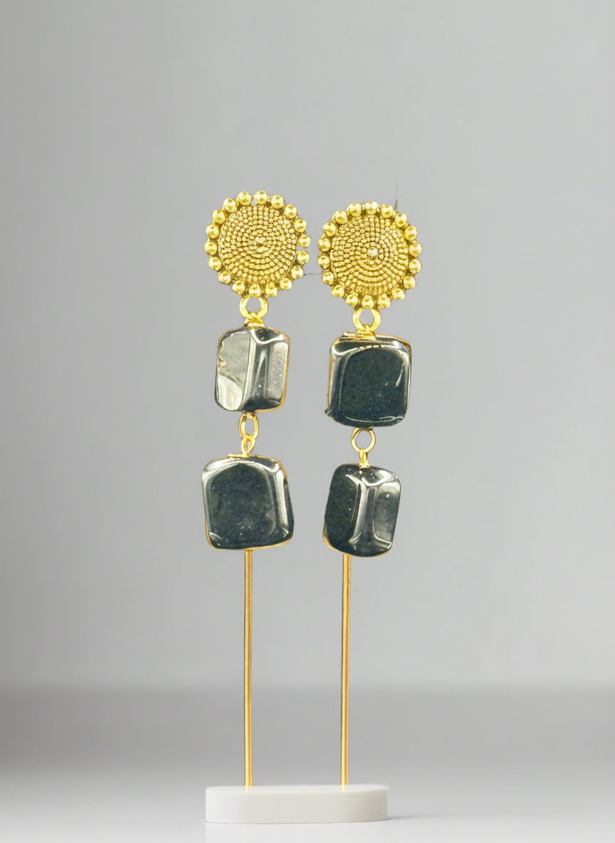 Mona lisa black stone with golden studs. 