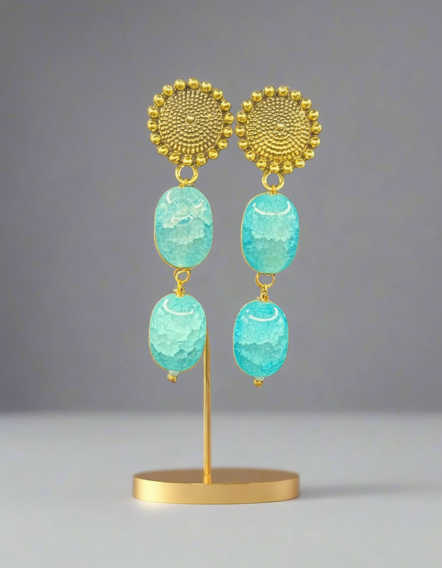 Mona lisa sky blue stone with golden studs. 